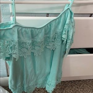 A teal off the shoulder tank